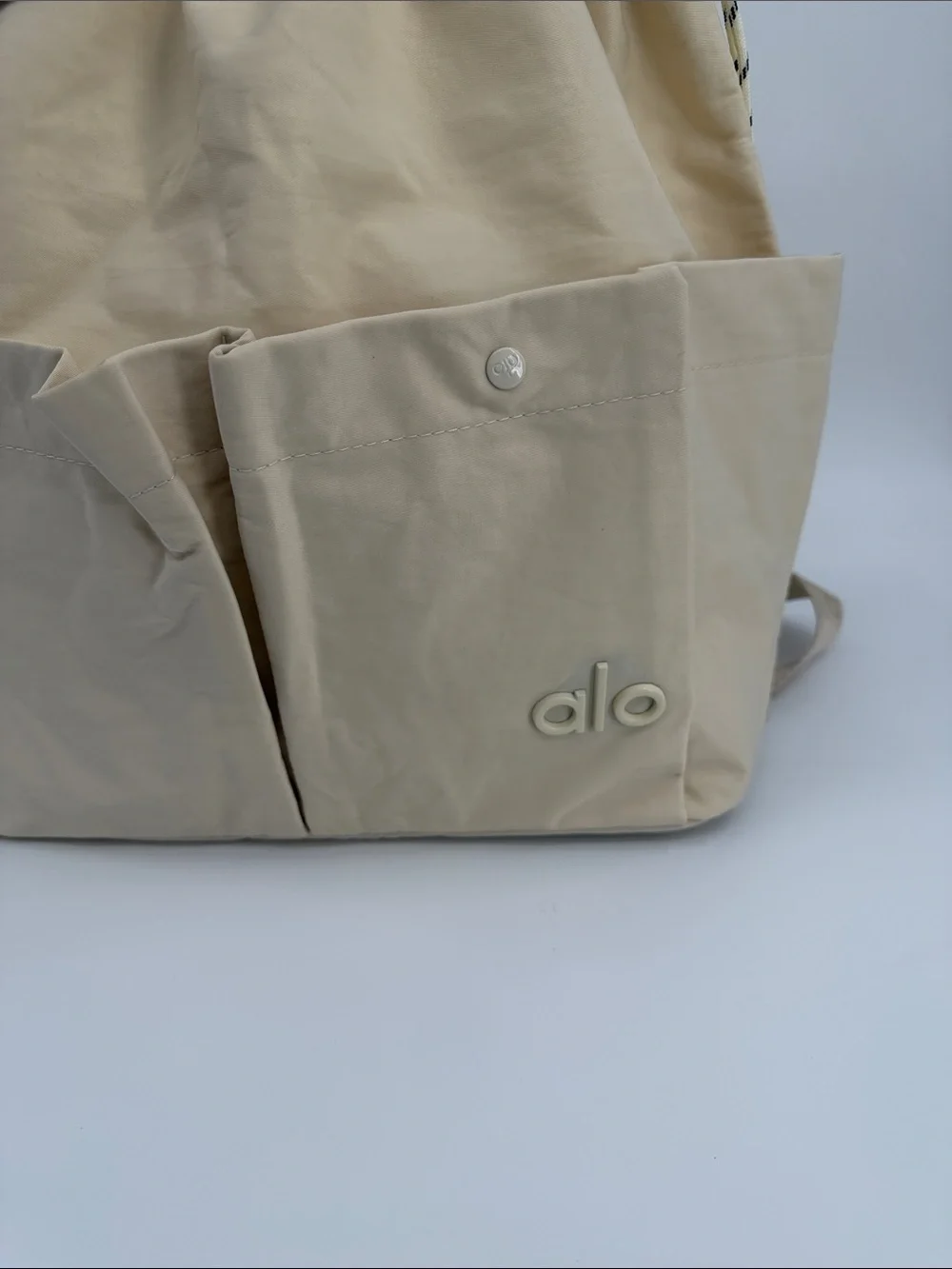 ALO Yoga Cream Drawstring Tote Backpack with Front Pockets Convertible Tote Bag